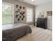 Cozy bedroom with carpet, a large window, and a chest of drawers at 2207 Cameron Pond Dr, Cary, NC 27519