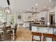 Eat-in kitchen features shaker cabinets, stone countertops, and stainless steel appliances at 2207 Cameron Pond Dr, Cary, NC 27519