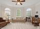 Bright living room with three large windows and desk at 2207 Cameron Pond Dr, Cary, NC 27519