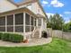 Inviting screened porch and backyard with patio and grill, perfect for outdoor entertaining and relaxation at 2207 Cameron Pond Dr, Cary, NC 27519