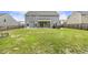 Large backyard with partial fence, patio, and a personal hot tub at 225 Rosewood Ln, Youngsville, NC 27596