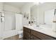 Clean bathroom with a shower-tub combo, a neutral color scheme, and a vanity with a white countertop at 225 Rosewood Ln, Youngsville, NC 27596
