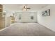 Large bedroom with soft carpet, great natural light, a ceiling fan, and built in shelving units at 225 Rosewood Ln, Youngsville, NC 27596