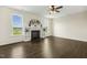 Comfortable living room with hardwood floors, a fireplace, built-in shelving, and lots of natural light at 225 Rosewood Ln, Youngsville, NC 27596
