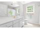 A bathroom with a white vanity with a sink, a mirror, a toilet, and a tub with a shower curtain at 228 Birch Creek Dr, Fuquay Varina, NC 27526