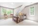 Bright bedroom with large windows providing ample natural light and two chairs at 228 Birch Creek Dr, Fuquay Varina, NC 27526