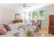 Serene bedroom with natural light, a ceiling fan, and traditional wooden furniture at 228 Birch Creek Dr, Fuquay Varina, NC 27526