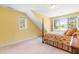Bright bedroom with four-poster bed and many windows providing natural light at 228 Birch Creek Dr, Fuquay Varina, NC 27526