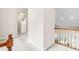 Hallway with carpet flooring and railing overlooking the living room at 228 Birch Creek Dr, Fuquay Varina, NC 27526