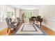 Cozy living room with hardwood floors, plush seating, and abundant natural light at 228 Birch Creek Dr, Fuquay Varina, NC 27526