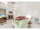 Bright living room featuring a stone fireplace, tall ceilings, and comfortable furnishings at 228 Birch Creek Dr, Fuquay Varina, NC 27526