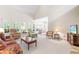Spacious living room with plush seating, vaulted ceilings, and abundant natural light at 228 Birch Creek Dr, Fuquay Varina, NC 27526