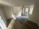 Unfinished basement featuring updated flooring, white door, and neutral walls at 2503 Chapel Hill Rd, Durham, NC 27707