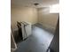 Unfinished basement laundry room with painted floor and washer at 2503 Chapel Hill Rd, Durham, NC 27707