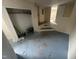 View of basement with paint supplies and partial flooring at 2503 Chapel Hill Rd, Durham, NC 27707