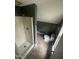 Bathroom with walk-in shower, vinyl floors, toilet and dark paint at 2503 Chapel Hill Rd, Durham, NC 27707