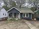Charming single-story home with covered porch and mature trees at 2503 Chapel Hill Rd, Durham, NC 27707