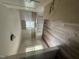 Bright kitchen with white cabinets, functional layout, and potential for modern upgrades at 2503 Chapel Hill Rd, Durham, NC 27707