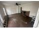 Cozy living room featuring a classic fireplace, large windows, and ample natural light at 2503 Chapel Hill Rd, Durham, NC 27707