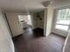 Room showing dark wood flooring, laundry hook-ups, and natural light from a window at 2503 Chapel Hill Rd, Durham, NC 27707