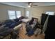 Spacious bedroom with ceiling fan, multiple beds, and large windows at 2505 Chapel Hill Rd, Durham, NC 27707