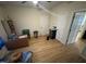 Bedroom with ceiling fan, wood floors and ample natural light from the window at 2505 Chapel Hill Rd, Durham, NC 27707