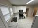 Bright kitchen featuring white cabinets, stainless steel appliances and marble countertops at 2505 Chapel Hill Rd, Durham, NC 27707