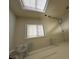 Bright room with skylight and window with metal racking on floor at 2505 Chapel Hill Rd, Durham, NC 27707