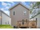 Back of home featuring a wooden deck and a small yard with privacy fence at 2801B Cannada Ave, Durham, NC 27704