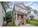 Two-story home featuring a welcoming front porch and tasteful exterior design at 2801B Cannada Ave, Durham, NC 27704