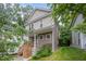 Charming two-story home with neutral siding, covered front porch, and mature trees at 2801B Cannada Ave, Durham, NC 27704