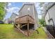 Back of home featuring a wooden deck and a small yard with privacy fence at 2801B Cannada Ave, Durham, NC 27704
