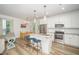 Stylish kitchen with granite countertops, stainless steel appliances and bar stool seating at 2801B Cannada Ave, Durham, NC 27704