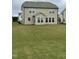A spacious backyard with a lush green lawn and a view of the house's exterior at 30 Junius Birch Trl, Franklinton, NC 27525