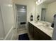 Bright bathroom featuring double sinks and a tub with shower at 30 Junius Birch Trl, Franklinton, NC 27525