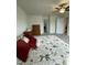 A bedroom with neutral walls, a floral bedspread, and wood dressers at 30 Junius Birch Trl, Franklinton, NC 27525