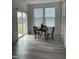 Bright dining area with a sliding glass door and modern flooring at 30 Junius Birch Trl, Franklinton, NC 27525