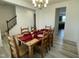 Spacious dining room featuring a traditional table with seating for eight and a modern chandelier at 30 Junius Birch Trl, Franklinton, NC 27525
