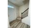 Welcoming entryway with new light-colored flooring and staircase access at 30 Junius Birch Trl, Franklinton, NC 27525