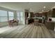Open-concept kitchen and dining area with stainless steel appliances and granite countertops at 30 Junius Birch Trl, Franklinton, NC 27525