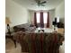 Inviting living room featuring carpeted flooring, comfortable sofas, and a ceiling fan at 30 Junius Birch Trl, Franklinton, NC 27525