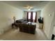 Bright living room with large windows, two sofas, and a ceiling fan at 30 Junius Birch Trl, Franklinton, NC 27525