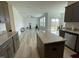 Open-concept living space featuring a kitchen, and adjacent exercise area at 30 Junius Birch Trl, Franklinton, NC 27525