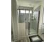 A bathroom featuring a shower with sliding glass doors and tile surround at 30 Junius Birch Trl, Franklinton, NC 27525