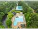 Aerial view of community pool, tennis courts, landscaping, and neighborhood recreational amenities at 3021 White Cloud Cir, Apex, NC 27502