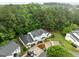 Aerial view of townhome complex featuring lush greenery, convenient parking, and well-maintained landscaping at 3021 White Cloud Cir, Apex, NC 27502