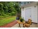 Cozy backyard featuring a seating area, an AC unit, well-maintained landscaping, and white siding at 3021 White Cloud Cir, Apex, NC 27502