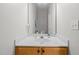 Clean bathroom with a well-lit vanity, a mirror, and fresh decor at 3021 White Cloud Cir, Apex, NC 27502