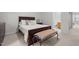 This comfortable bedroom includes furnishings with a bench and plenty of light at 3021 White Cloud Cir, Apex, NC 27502