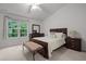 Comfortable bedroom with a large window and coordinated furniture set at 3021 White Cloud Cir, Apex, NC 27502